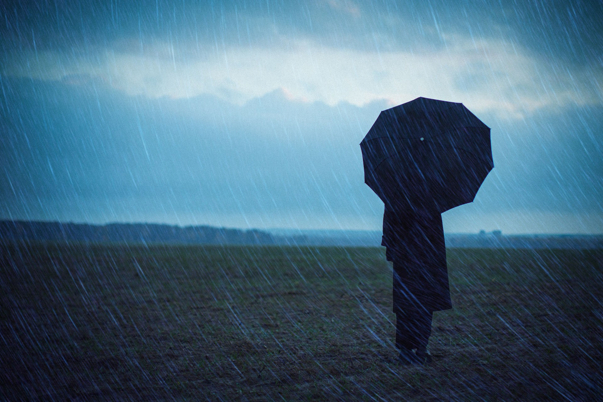 Woman with umbrella. Rain. Bad weather. Depression